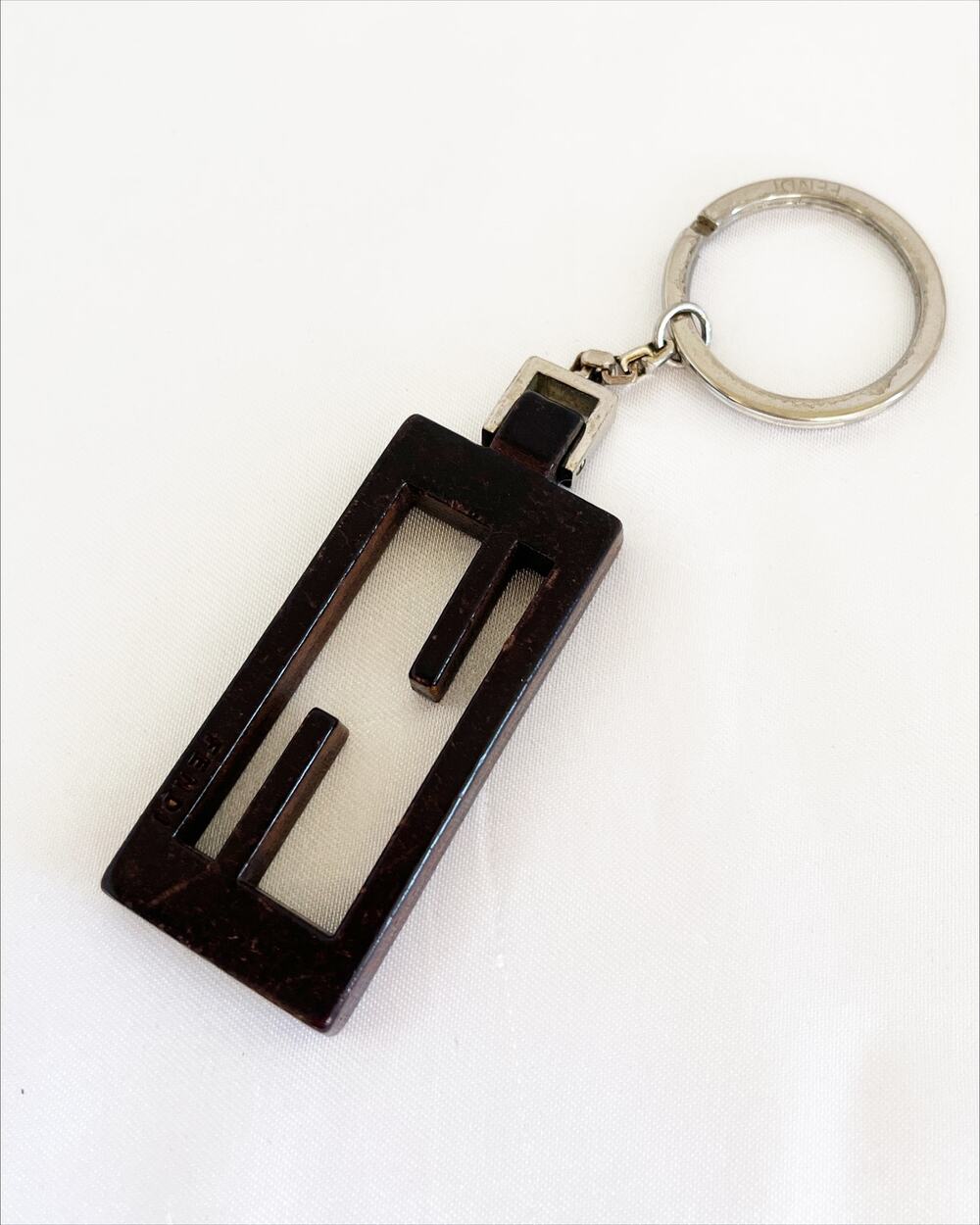 FENDI Key Chain Vintage Logo Cut Out Rectangular Silver Tone Wood Grain Stamped